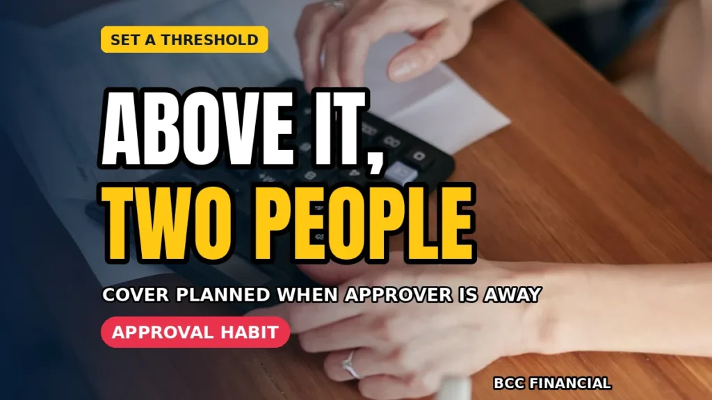 A business payment screen, an invoice and a second reviewer with a notepad checking details at an office desk