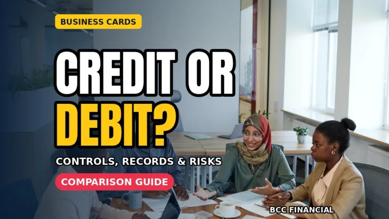 business credit card vs debit card comparison table reviewed by a small business owner at a desk