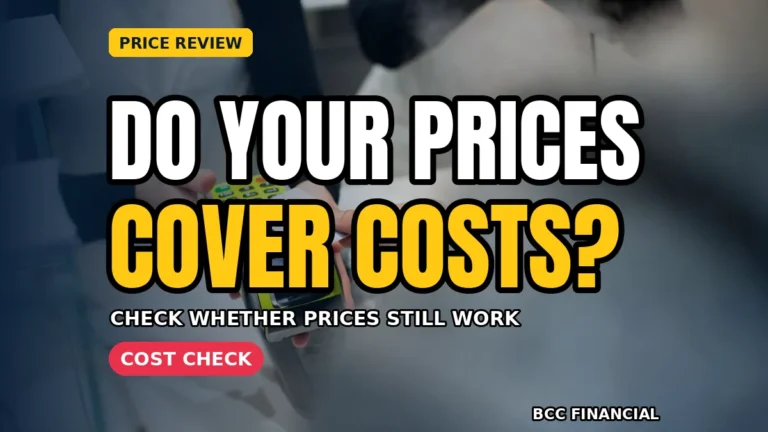 Owner checking when to raise prices small business costs on a calculator beside a current price list