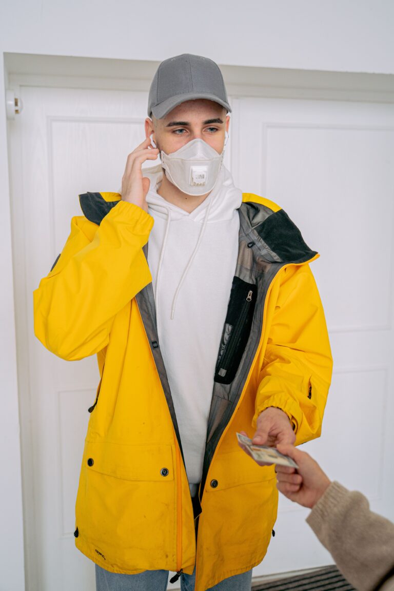 A courier receiving cash during a business cash collection pickup