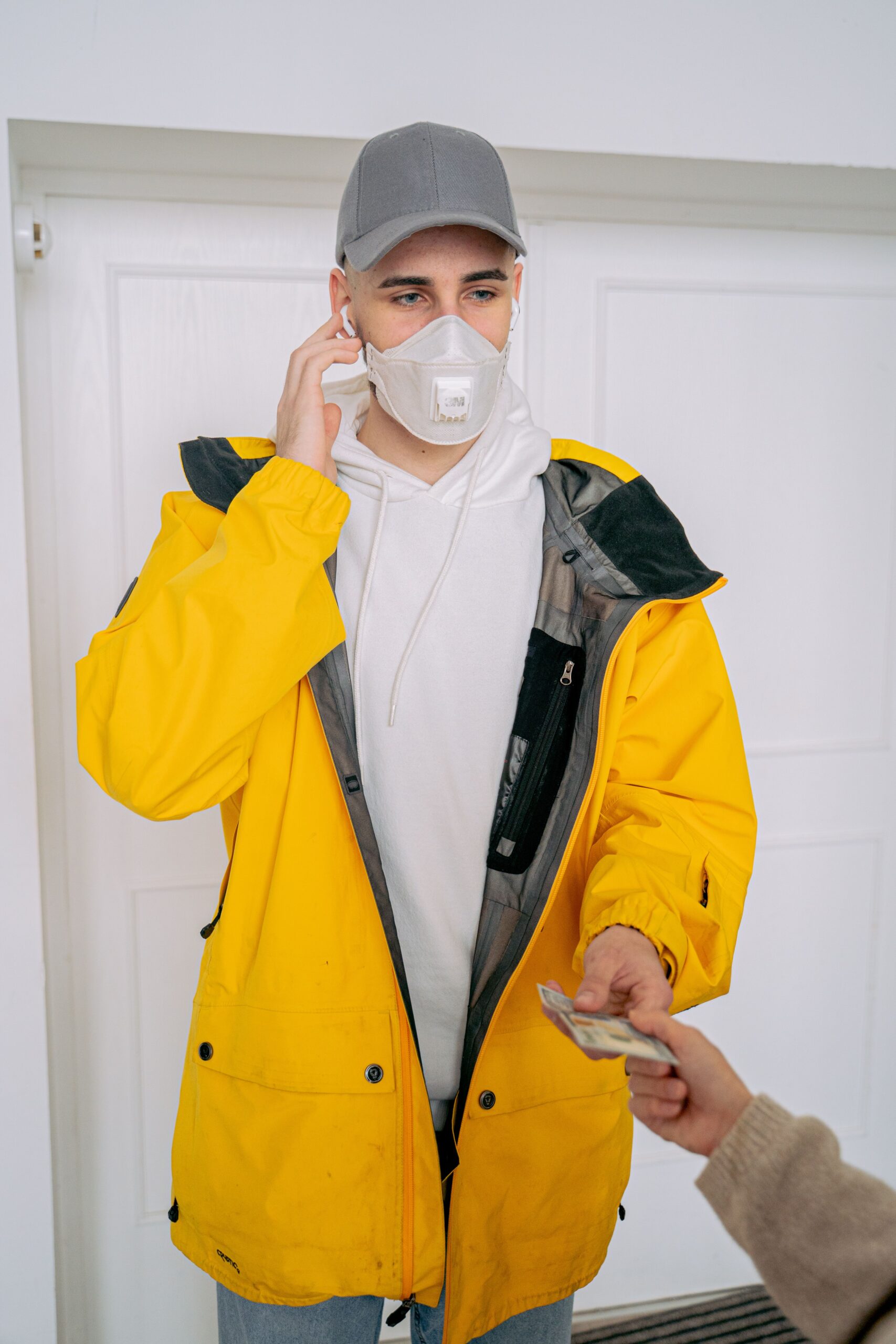 A courier receiving cash during a business cash collection pickup