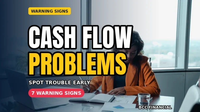 Cash flow problems: a businesswoman in an orange blazer analysing documents at her office desk
