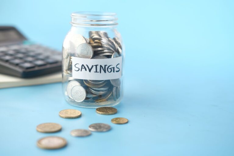 A savings jar of coins representing a business cash reserve for emergencies
